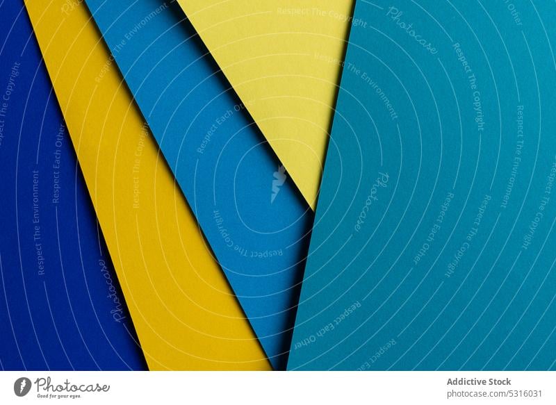 Arranged sheets of colorful carton layout blue yellow background tone blocking shade cardboard surface material design texture trend simple minimalist paper