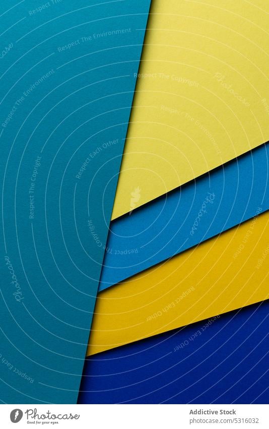 Arranged sheets of colorful carton layout blue yellow background tone blocking shade cardboard surface material design texture trend simple minimalist paper