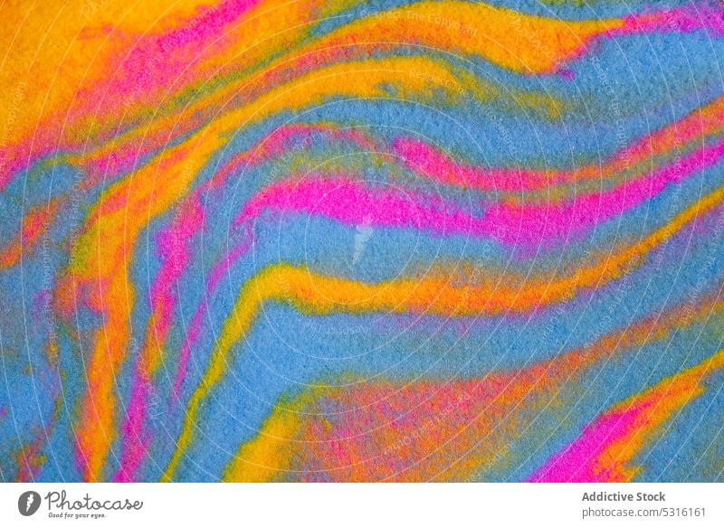 Close-up view of beautiful abstract multicolored waves made from colorful clay plasticine colors mix paint background textured background spills art dye liquid