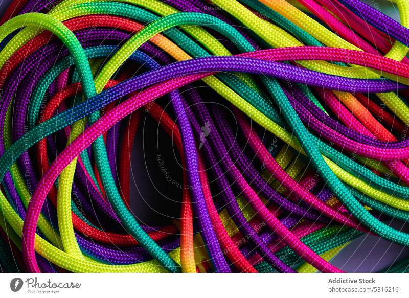 Vibrant colorful laces in pile rope twine vibrant multicolored vivid bright layout string mix shoelace cord fabric spectrum fiber untied art material minimalist