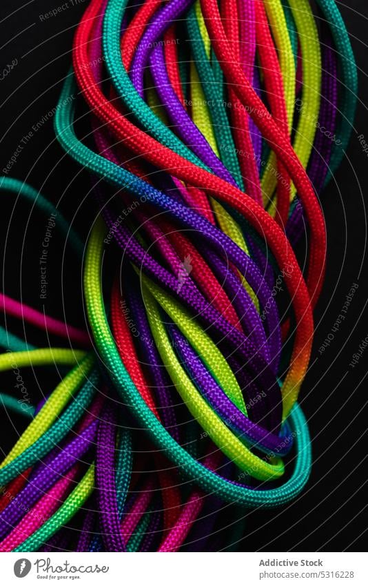 Vibrant colorful laces in pile rope twine vibrant multicolored vivid bright layout string mix shoelace cord fabric spectrum fiber untied art material minimalist