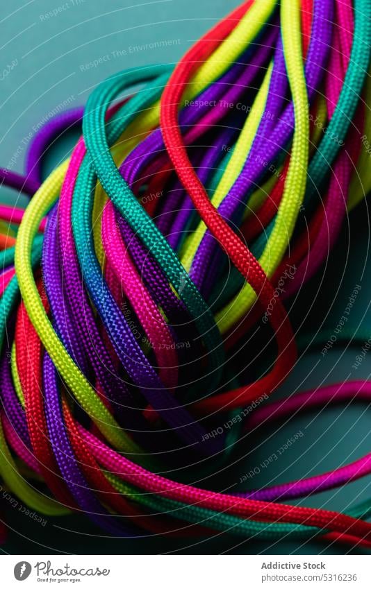 Vibrant colorful laces in pile rope twine vibrant multicolored vivid bright layout string mix shoelace cord fabric spectrum fiber untied art material minimalist