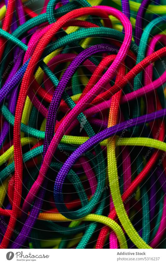 Vibrant colorful laces in pile rope twine vibrant multicolored vivid bright layout string mix shoelace cord fabric spectrum fiber untied art material minimalist