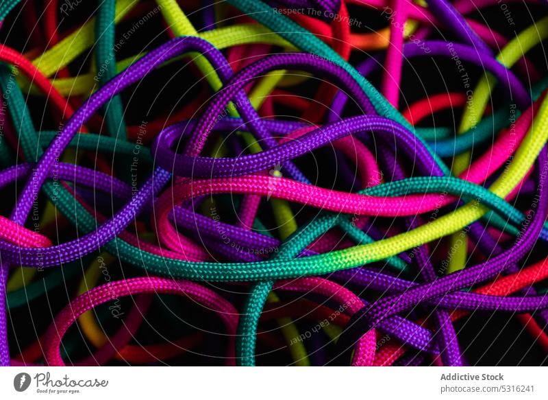 Vibrant colorful laces in pile rope twine vibrant multicolored vivid bright layout string mix shoelace cord fabric spectrum fiber untied art material minimalist