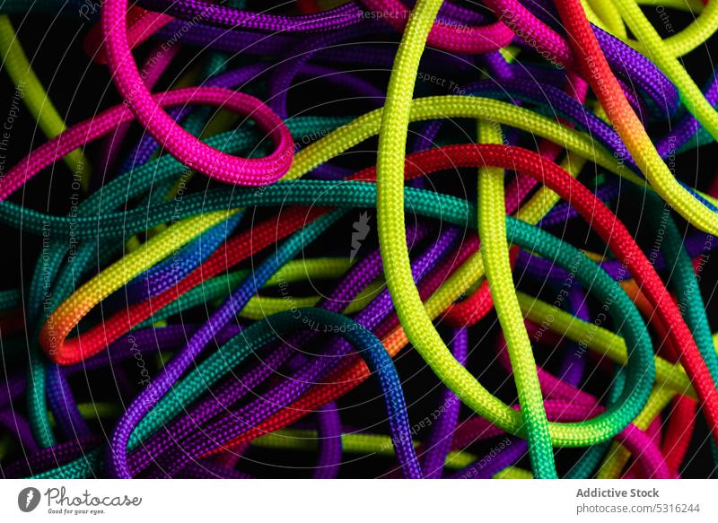 Vibrant colorful laces in pile rope twine vibrant multicolored vivid bright layout string mix shoelace cord fabric spectrum fiber untied art material minimalist