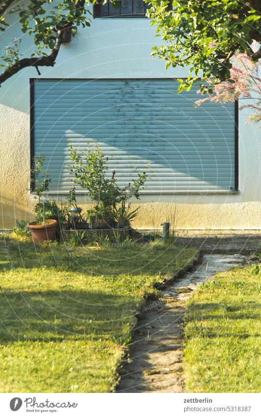 Blind, roller blind, window, facade Facade locked Closed Roller blind Meadow Twig tepid Window Venetian blinds Depth of field Copy Space shrub trunk Plant