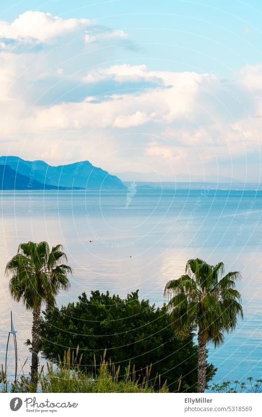 Mediterranean Sea near Kemer with the Taurus Mountains in the background. Mediterranean sea Turkey Ocean vacation holidays Palm tree mountain Vacation & Travel