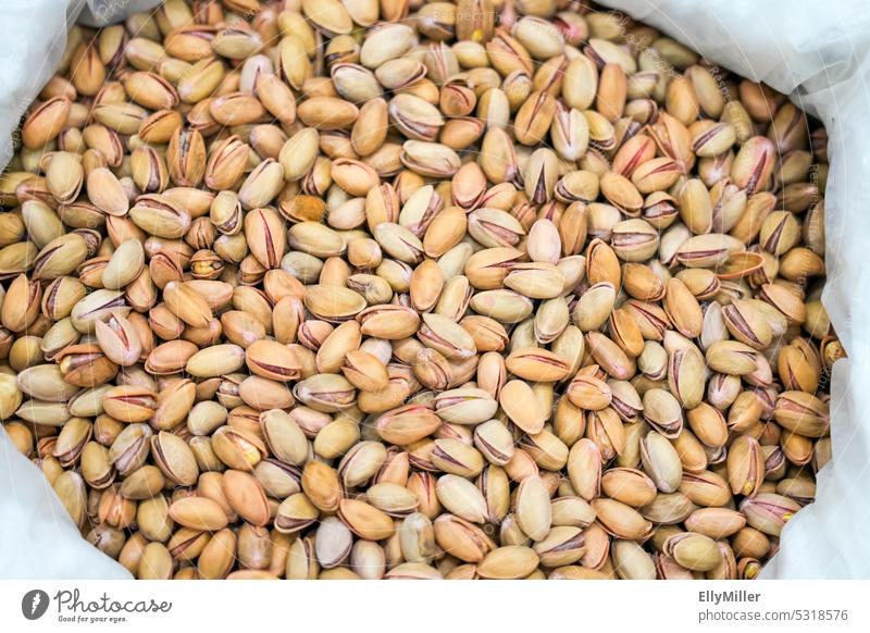 A bag full of pistachios Pistachios Pistachios with shell Close-up Healthy Nutrition Healthy Eating Food photograph Organic produce Vegan diet Delicious