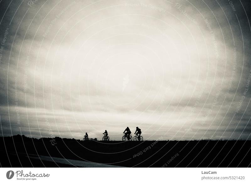 Cyclist on the dike Cycling cyclists Silhouette Dike Shadow somber Dark Twilight Evening Bicycle Outdoors Sky Clouds