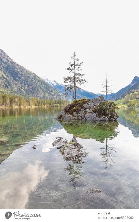 small rock island in lake with reflection rear lake Lake Rock trees mountain lake mountains Reflection in the water Sky Lakeside Bavaria Vacation & Travel Idyll