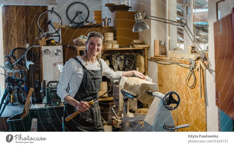 Portrait of confident craftswoman in her workshop real people woodshop carpenter entrepreneur expertise craftsperson creativity manufacturing crafts people