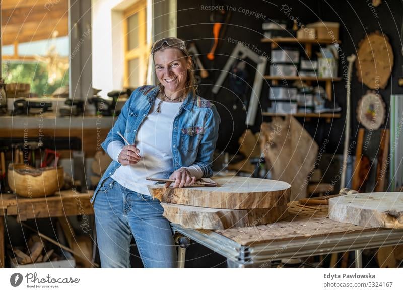 Portrait of confident craftswoman in her workshop real people woodshop carpenter entrepreneur expertise craftsperson creativity manufacturing crafts people