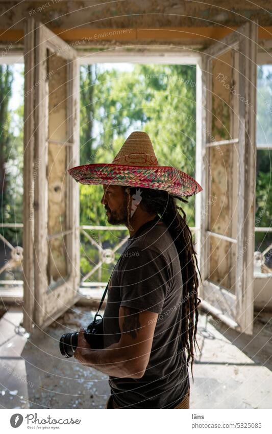 Lost Land Love l photographer with sombrero Man Sombrero Photographer Hat lost place forsake sb./sth. Past Change Building Ravages of time Broken Decline