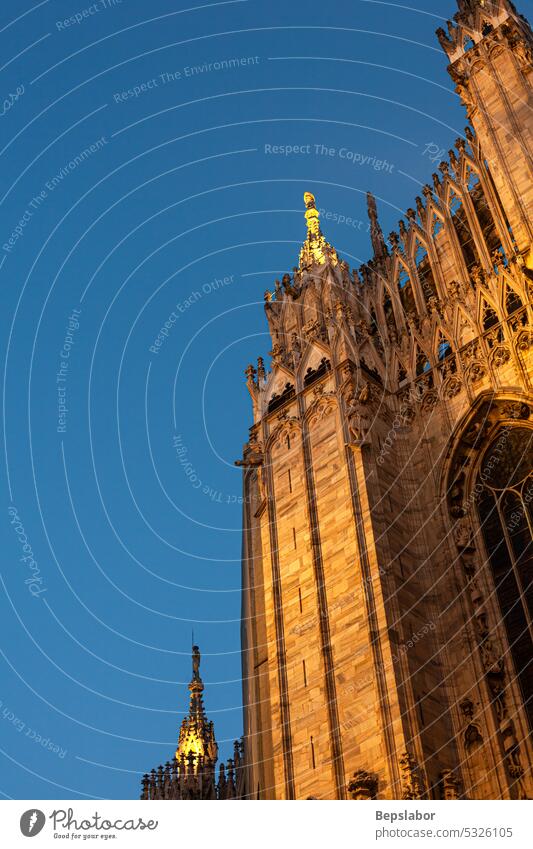 Beautiful Milan cathedral close up view. Duomo di Milano closeup milan italy sculpture duomo marble religion gothic illuminated sunset history statue historical