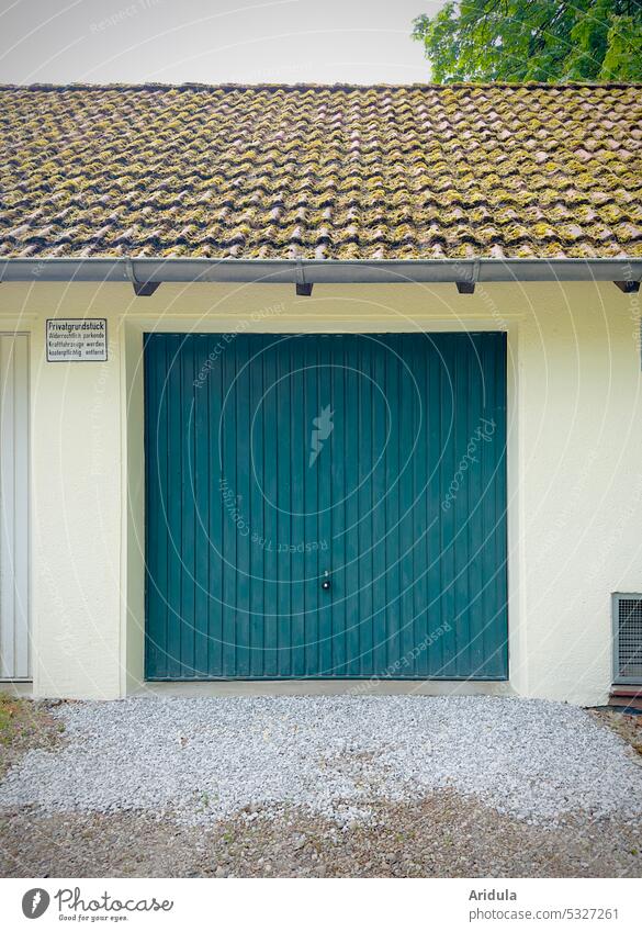 Garage house with blue green garage door House (Residential Structure) Parking car Parking lot Transport Town Parking garage Highway ramp (exit) roof tiles