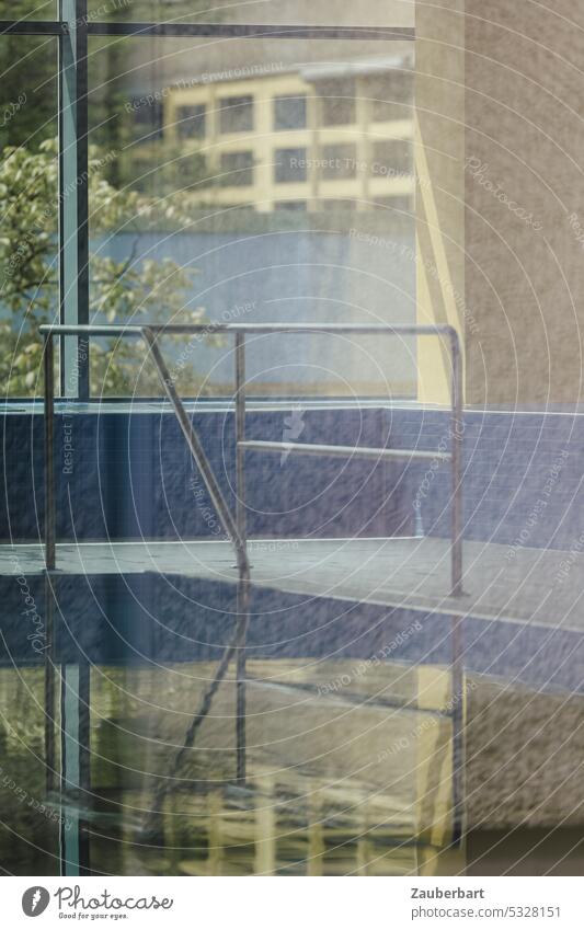 Indoor swimming pool, steel bracket as entrance, swimming pool and geometric window frames in pastel colors, light effects of the pane Lighting effect