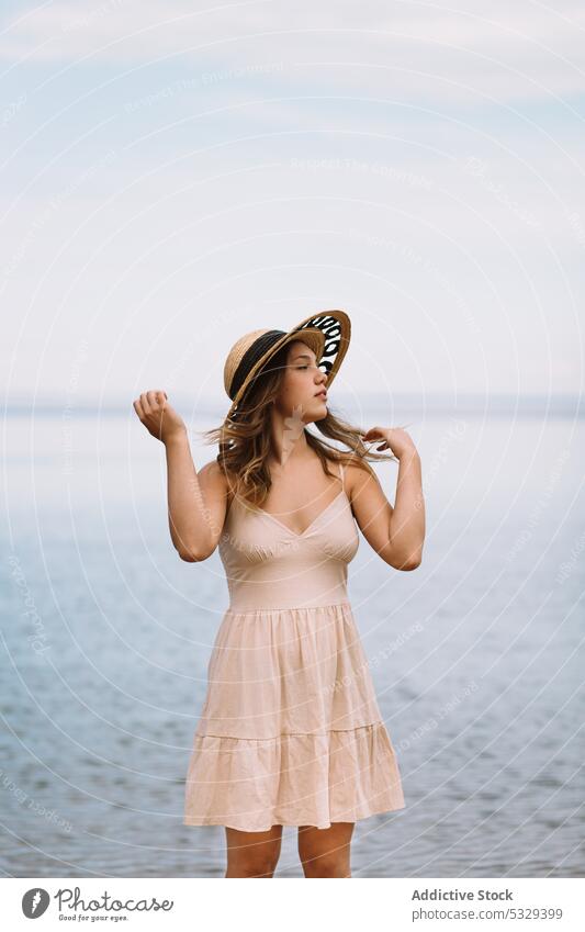 Woman in sunhat admiring seascape woman model straw hat rest summer vacation portrait female travel tourism trip journey holiday weekend relax chill ocean water