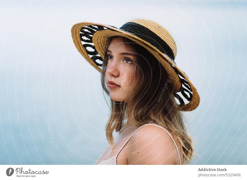 Woman in sunhat admiring seascape woman model straw hat rest summer vacation portrait female travel tourism trip journey holiday weekend relax chill ocean water