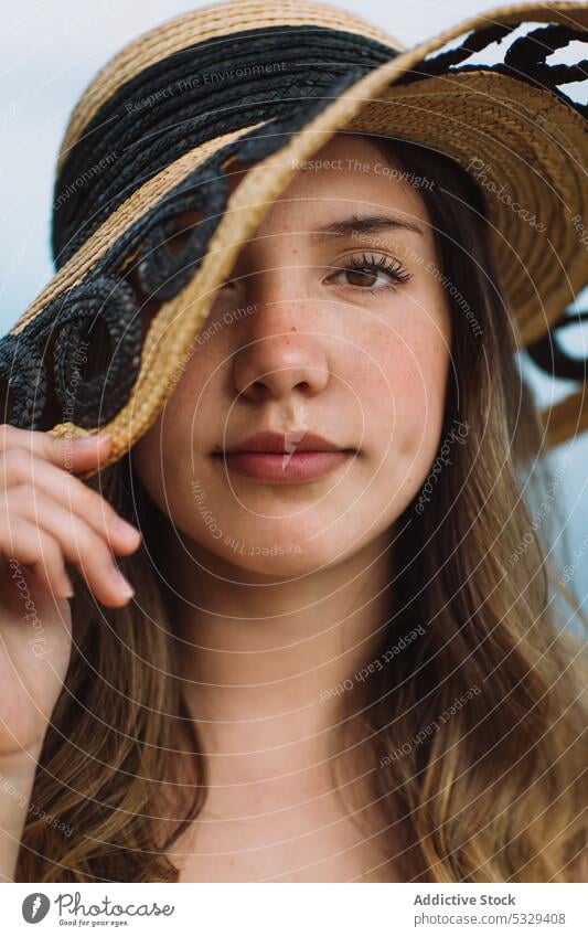 Woman hiding face behind sunhat woman model straw hat cover face hide rest summer vacation portrait female travel tourism trip journey holiday weekend relax