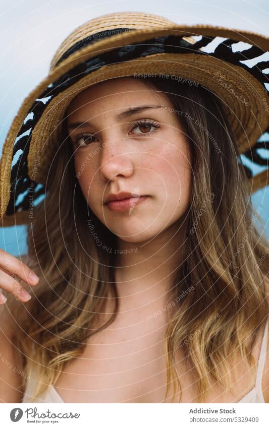 Woman in sunhat admiring seascape woman model straw hat rest summer vacation portrait female travel tourism trip journey holiday weekend relax chill ocean water