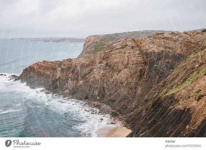 Breathtaking beach of Praia da Manteiga with its high cliffs near Vila Do Bispo, Algarve, Portugal. Wandering the Rota Vicentina. Crossing the west coast