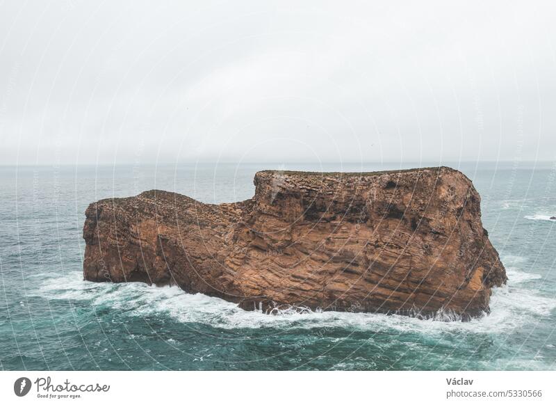 Rocky coastline of the Atlantic Ocean in the south-west of Portugal in the Algarve region. Exploring the beautiful rugged nature of the Fisherman Trail. Cape St. Vincent