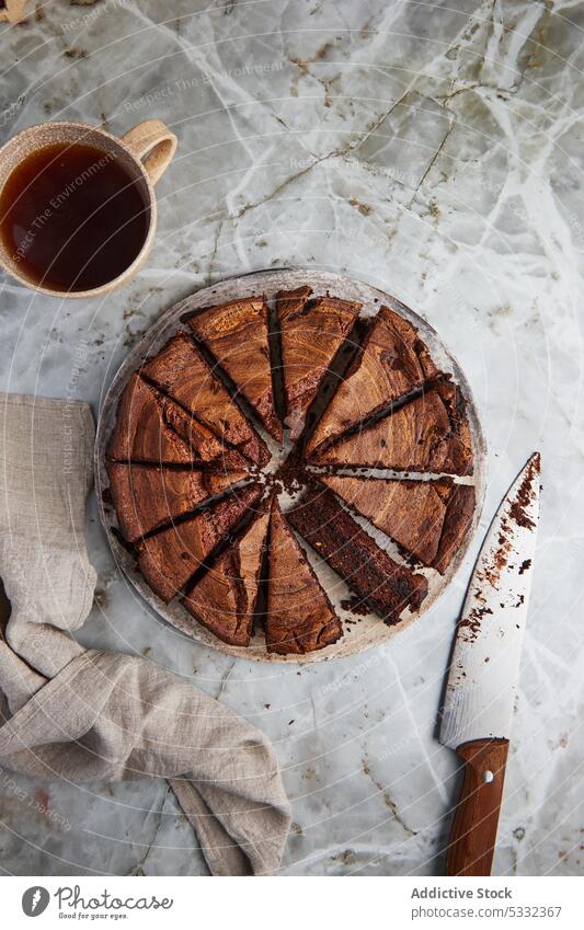 Cup of tea with served cut cake chocolate dessert slice sweet yummy delicious food pie drink bowl knife table cup transparent beverage hot drink tasty treat