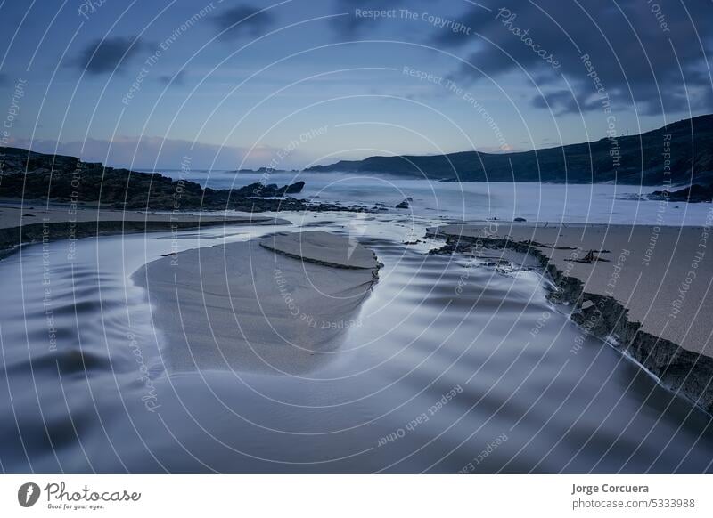 Long exposure of waves on beach. Rosguill peninsula, County Donegal, Ireland, Dooey village long water sea landscape sky nature coast ocean blue seascape shore