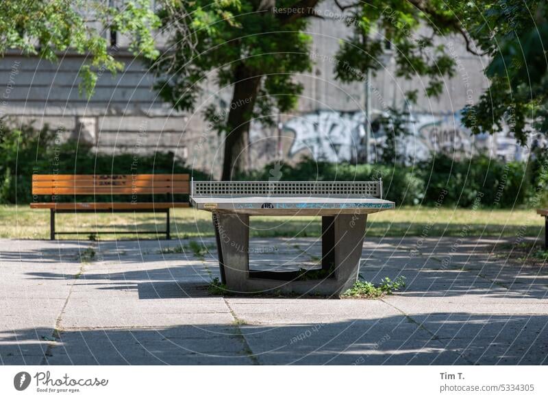 Table tennis table at the bunker Park Berlin Middle Sports Leisure and hobbies Exterior shot Playing Deserted Colour photo Day Green Sporting Complex