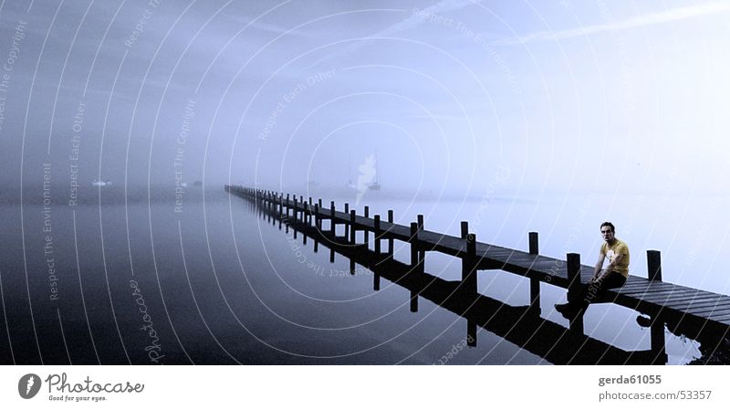 Panorama shore Footbridge To go for a walk Cold Far-off places T-shirt Man Wood Fog Jetty Reflection Coast Sit Wait Looking Water Contrast Legs