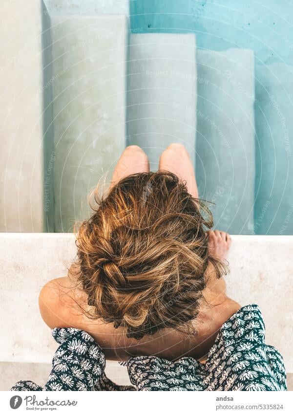 Woman sitting in pool by stairs Sit Stairs from on high swimming pool Stone Art Style Esthetic composition Water Summer Vacation & Travel Relaxation