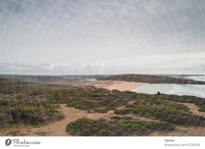 Portuguese landscape of endless plains and sandy beaches along the rocky cliffs of the Odemira region. Wandering along the Fisherman Trail praia da carreagem