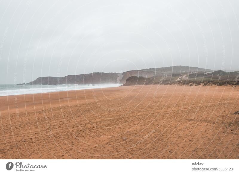 Wandering along the Fisherman Trail in the Algarve region of southwestern Portugal. Human footprints in the sandy surface step imprint human journey seascape