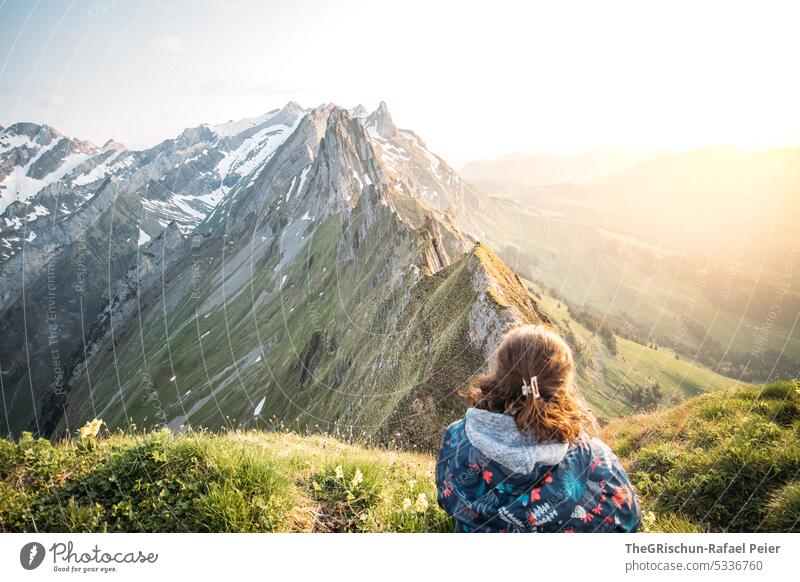 Woman in front of mountains with sunset Rock Switzerland appenzellerland Stone Hiking touristic Exterior shot Tourism Mountain Colour photo Alpstein Nature Sun