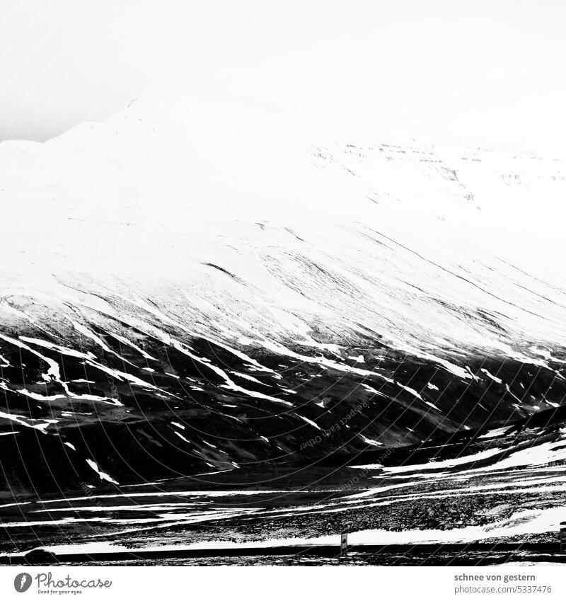 Snow and mountains in iceland Iceland Exterior shot Nature Landscape Mountain Water Environment Day Deserted Rock Elements Wild Moody Climate Cold Sky Hill Dark