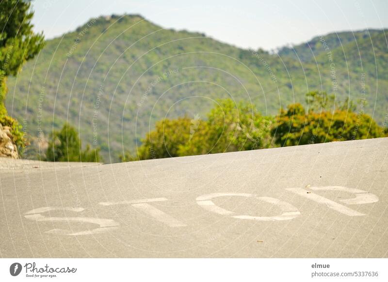 STOP stands on a road in the middle of green landscape on Elba stop Street Signs and labeling Stop Road Road traffic Lanes & trails Blog Italy Southern