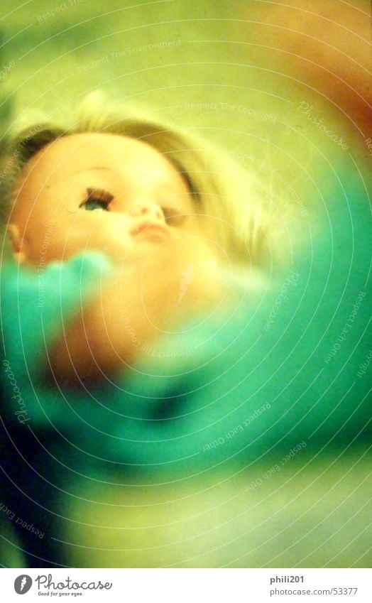 Doll. Neon light Green Blonde Pout Child Woman Toys Turquoise Looking Perspective