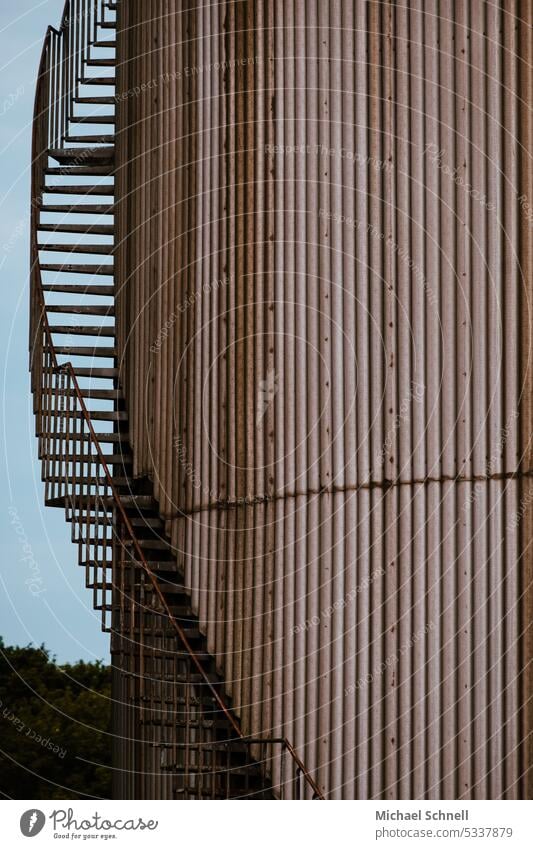 Exterior staircase on industrial tower Industry Industrial Photography Stairs upstairs Industrial zone Architecture Industrial plant Industrial site Round Tower