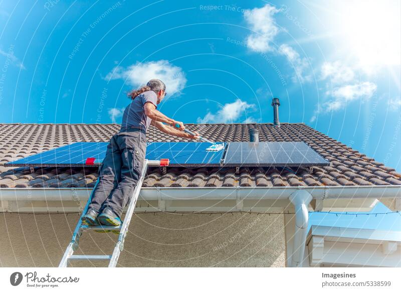 Cleaning balcony power plant on the roof in the sunny sky. Cleaning with mop cleaning Balcony power plant Roof Sky Mop Wash solar modules Holiday season 3 600 W