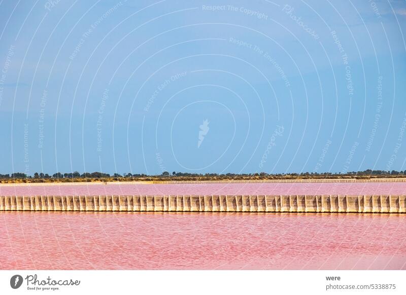 View over the pink salt pans of salt production near the town of Aigues-Mortes in the Camarque region of France Canal du Midi Canal du Rhône à Sète Evaporation