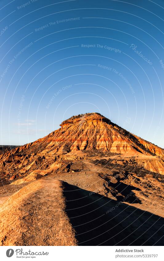 Rocky mountain ridge with rough rocks in desert nature geology uneven formation peak cliff range arid landscape rocky stone dry sandstone highland terrain hill