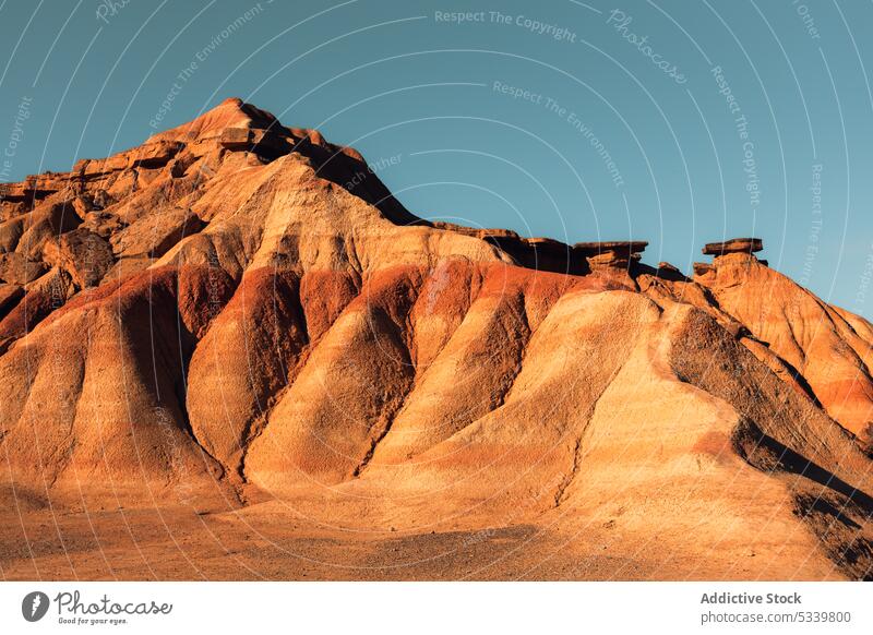 Rocky mountain ridge with rough rocks in desert nature geology uneven formation peak cliff range arid landscape rocky stone dry sandstone highland terrain hill