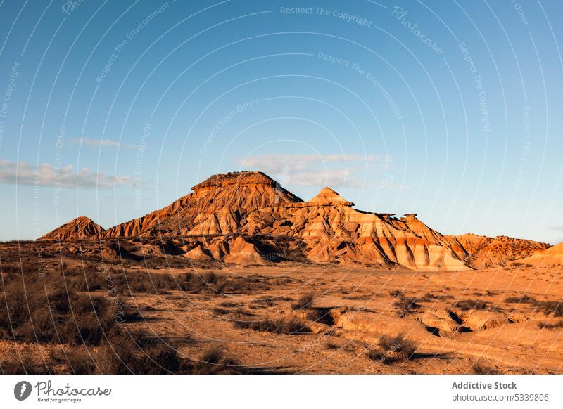 Rocky mountain ridge with rough rocks in desert nature geology uneven formation peak cliff range arid landscape rocky stone dry sandstone highland terrain hill