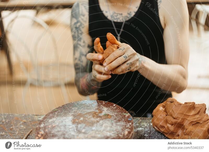 Man creating clay pot on wheel man pottery artisan workshop shape craft creative skill ceramic small business handicraft handmade process professional