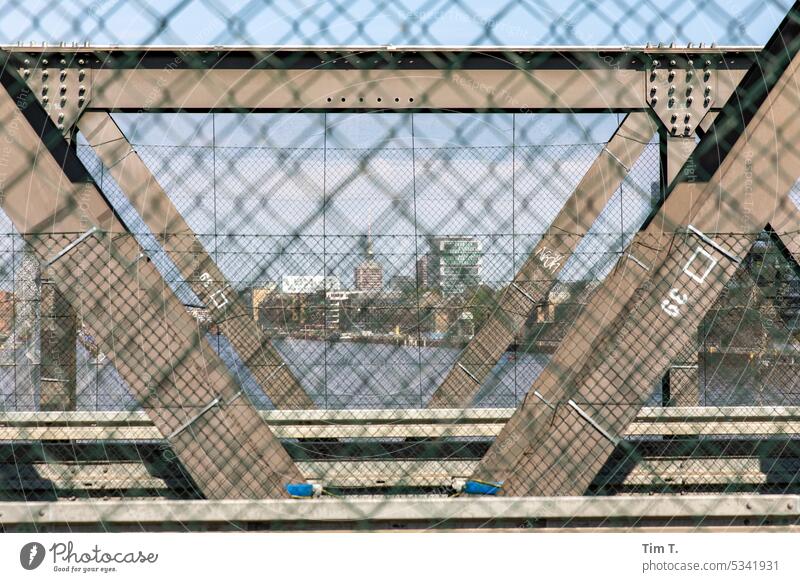 View through a bridge in Berlin Television tower Bridge Spree Fence Skyline Capital city Landmark Berlin TV Tower Downtown Tourist Attraction Town Architecture