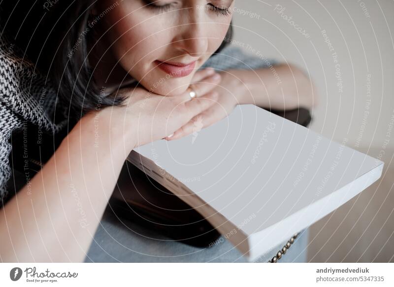 Tired young woman or Entrepreneur sleeping on sofa after long hours work on laptop, Overworked exhausted. businesswoman is resting her head on a empty papers and computer,feeling stressed out. mock up