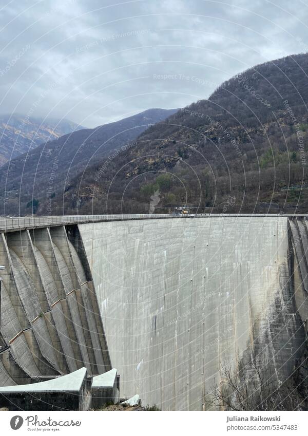 Dam in Switzerland with Golden Eye Bungee Jumping dam Sun Water Blue Summer Sky Nature Lake Clouds Landscape Exterior shot Mountain Vacation & Travel