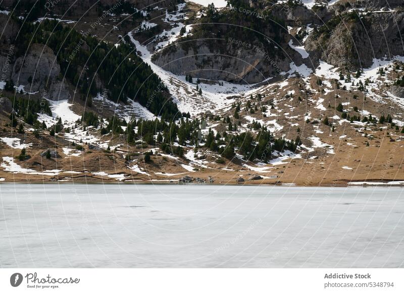 Spectacular scenery of rough rocky snowy mountains near calm lake in nature of Pyrenees ridge tree highland landscape range pyrenees spain spectacular formation