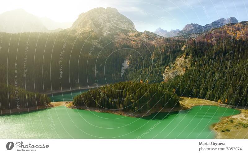 Amazing aerial drone view of Black Lake in National Park Durmitor, Montenegro. Mountain lake landscape on autumn sunset. black lake crno jezero durmitor zabljak