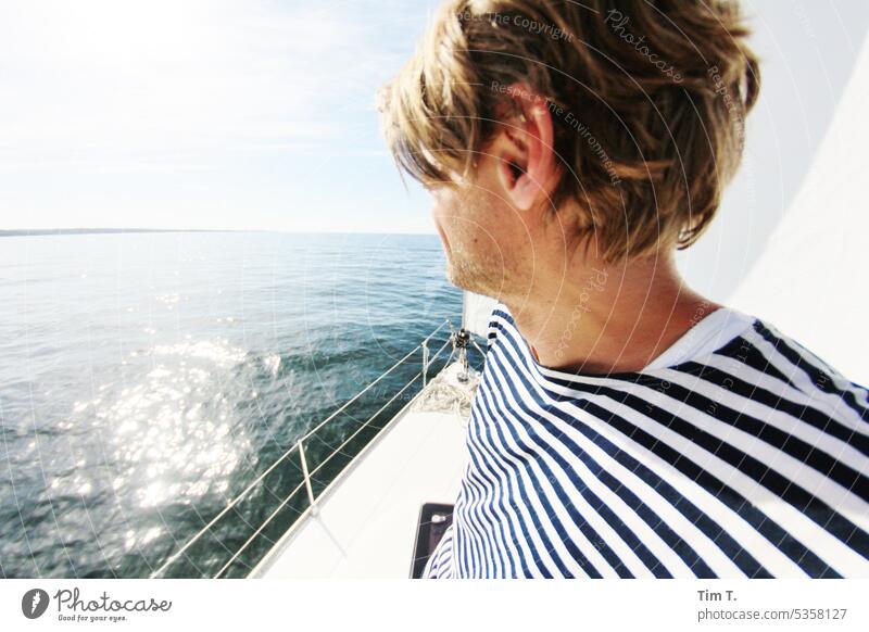 Looking ahead Sailing Baltic Sea Man Striped sweater Ocean Water Sailing ship Sailboat Colour photo Exterior shot Day Sky Navigation Vacation & Travel Freedom